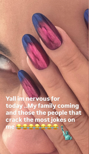 Cardi B shows off her nails on Instagram Stories. They're a bluetored ombr with a metallic chrome finish.